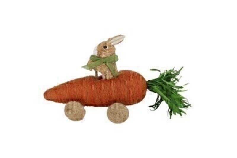 Bristle bunny sitting in a string carrot car.  Ornament from designer Giesela Graham who designs unique Easter gifts and decorations. Would make a lovely Easter gift.
